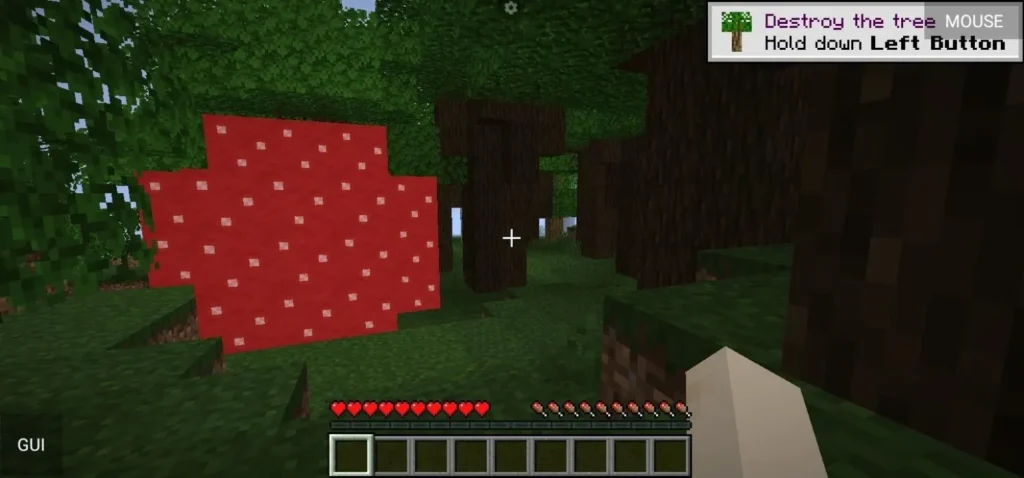 Gameplay screen in Minecraft Java Edition showing the player in a forest with the tutorial tip “Destroy the tree.”